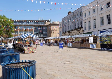 As lockdown eases a small number of shoppers and few stallholders attend the open air market,