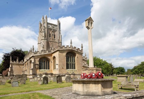 Cotswolds historic stone building churchyard of Church of Saint Mary, Fairford, Gloucestershire,
