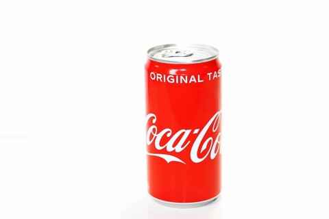 Coca-Cola can in front of a white background