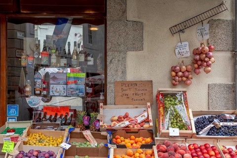 Shop with a range of different types of fruit and the famous Roscoff onions, Roscoff, Brittany,