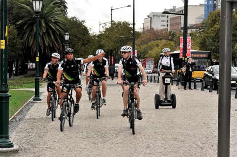 Tourists on a cruise ship during a shore excursion with bicycles and Segway, Praca Marques de