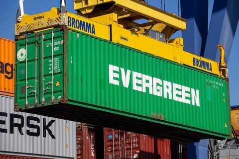 An Evergreen Line container is loaded in the port of Mannheim, Germany. Supply bottlenecks and a