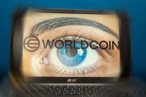 Logo of the new cryptocurrency Worldcoin on a laptop. Anyone wishing to participate in World Coin