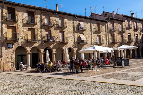 People sitting outside cafe in Plaza Mayor, Siguenza, Guadalajara province, Spain, Europe