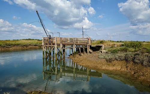 Canal and crane for oyster farming in Saint-Pierre-d'Oleron, Departement Charente-Maritime,