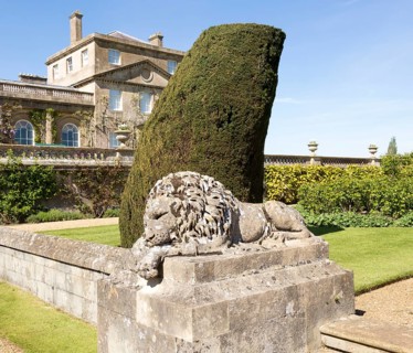 Stone lion sculpture terrace garden Bowood House and gardens, Calne, Wiltshire, England, UK