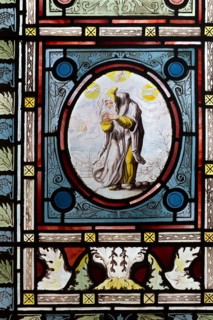 Flemish images in stained glass window church of Saint John, Saxmundham, Suffolk, England, UK