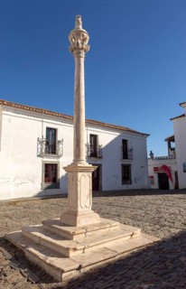 Marble post reputedly used for slave auctions in side historic walled hilltop village of Monsaraz,