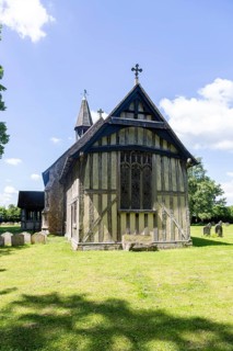 Village parish church of All Saints, Crowfield, Suffolk, England, UK with wooden timber framed