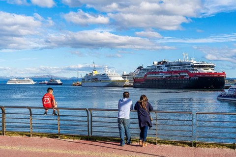 People watching cruise ships in the harbour at the Beagle Channel, Ushuaia, Tierra del Fuego