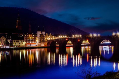 Night shot of Heidelberg. In December 2022, the Old Bridge is unlit with the exception of the