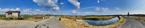 Lock, ditches and water basins in the landscape formerly for salt extraction and today for oyster