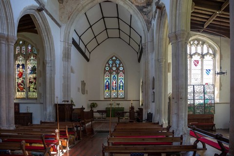 Village parish church of All Saints, Chelsworth, Suffolk, England, UK view to chancel and east