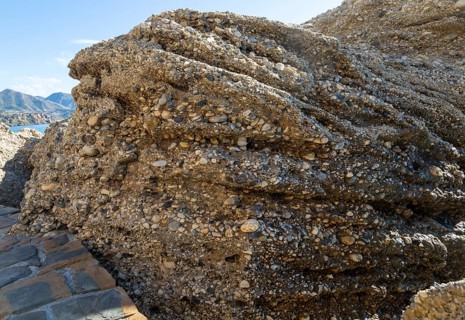 Close up of coastal cliff composed of conglomerate sedimentary rocks at Nerja, Andalusia, Spain,
