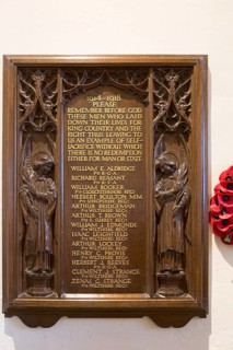 Elaborately carved wooden Arts and Crafts First World War 1914-1918 memorial, All Saints church,