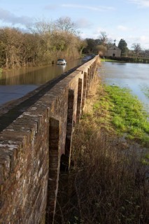Mini Cooper S car stuck in River Avon flood water, Kellaways bridge, Wiltshire, England, UK
