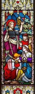 Stained glass window in church of Saint John the Baptist, Badingham, Suffolk, England, UK circa