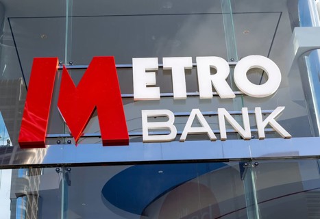 Signs on Metro Bank building, Regent Street, Swindon, Wiltshire, England, UK