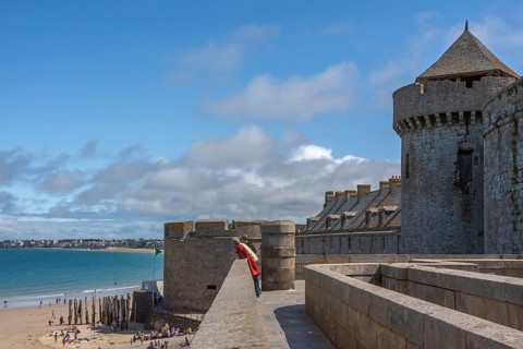 Tourists on the city wall of Saint Malo, Brittany, France, Europe