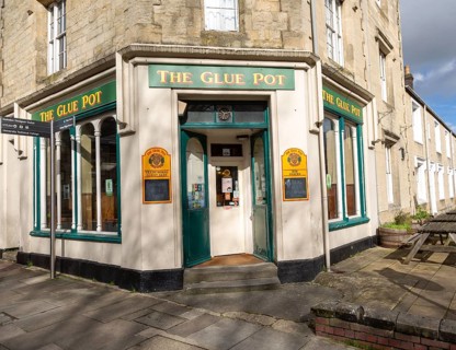 The Glue Pot pub on corner of terraced housing street in the Railway Village, Swindon, Wiltshire,