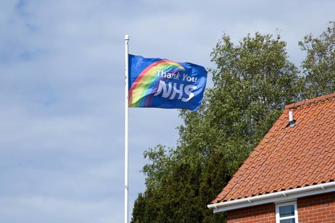 Thank You NHS flag flying in breeze, UK during 2020 Coronavirus Covid-19 crisis