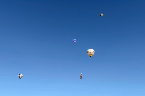 Five hot air balloons in the blue sky, Montgolfiade Tegernseer Tal, Balloon Week Tegernsee,