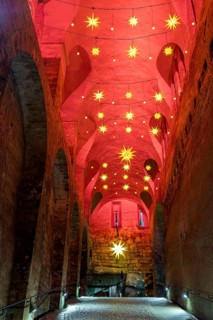 Winter atmosphere at the mountain fortress. Dark appareille with Advent stars, Koenigstein, Saxony,