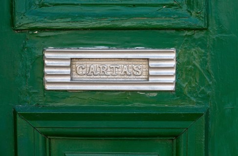 Close up of traditional style letterbox on front door of house in Evora, Alto Alentejo, Portugal,