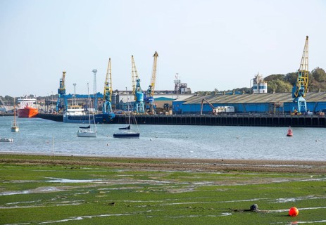 Cranes warehouses ships quayside at Cliff Quay, Port of Ipswich, Suffolk, England, UK tidal River