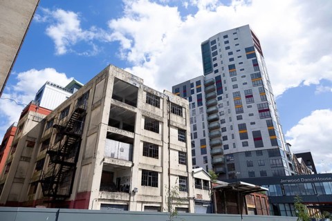 Contrast derelict industrial building modern housing development high rise flats, Wet Dock