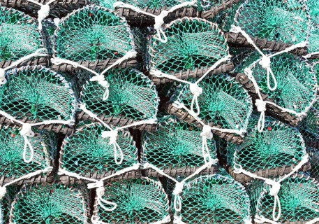 Piles of new lobster pots on Holy Island, Lindisfarne, Northumberland, England, UK close up