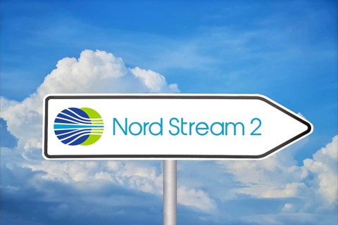 Symbolic image Nord Stream 2: Traffic sign with logo in front of blue sky (Composing)