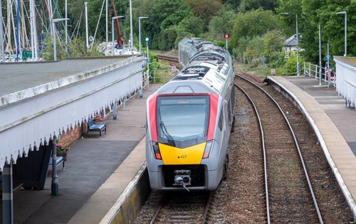 British Rail Class 755 Stadler bi-modal train leaving railway station at Woodbridge, Suffolk,