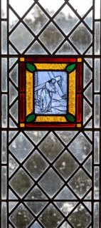 Village parish church Cratfield, Suffolk, England, UK stained glass panel of Jesus Christ carrying