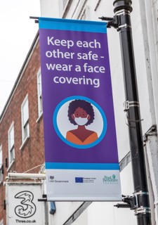 Keep each other safe wear a face covering Covid 19 information poster, Newbury, Berkshire, England,