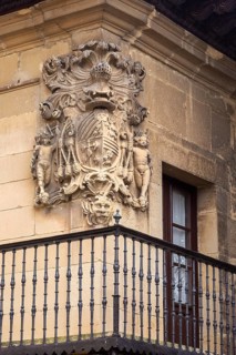 Stonework detail of coat of arms on wall of building, village of Elceigo, Alava, Basque Country,