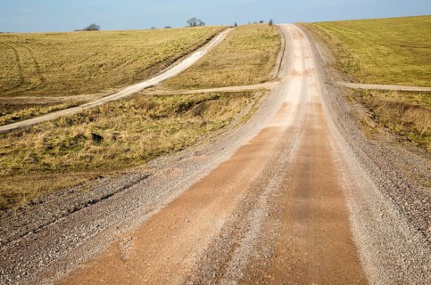 Unsurfaced road track crossing chalk landscape scenery near Chitterne, Salisbury Plain, Wiltshire,