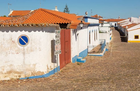 Small traditional rural settlement village with low rise one story houses and cobbled streets,