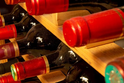 Wine cellar with red wine bottles (editorial)