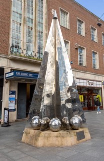 Riddle sculpture by Michael Fairfax, High Street, Exeter city centre, Devon, England, UK