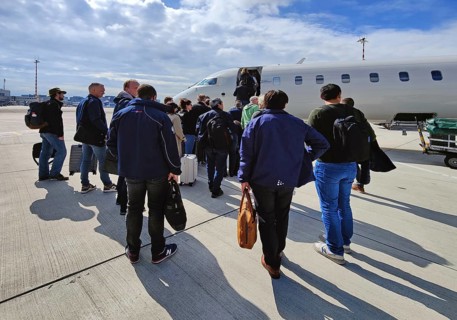 Passengers with hand luggage boarding a small aircraft on the tarmac, Duesseldorf Airport, North
