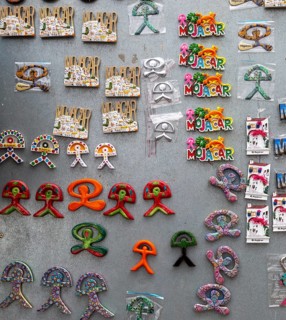 Various products with Indalo design on sale at souvenir shop in village of Mojacar, Almeria, Spain,
