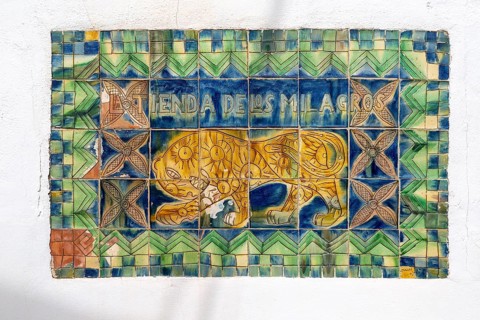 Tiles forming sign for ceramic and textile shop, La Tienda de los MIlagros, Nijar, Almeria, Spain,