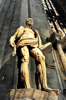 Sculpture of St Bartholomew in front of Milan Cathedral, Duomo, construction started in 1386,