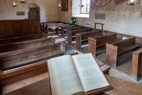 Medieval frescoes church of Saint Mary, Kempley, Gloucestershire, England, UK, bible on pulpit