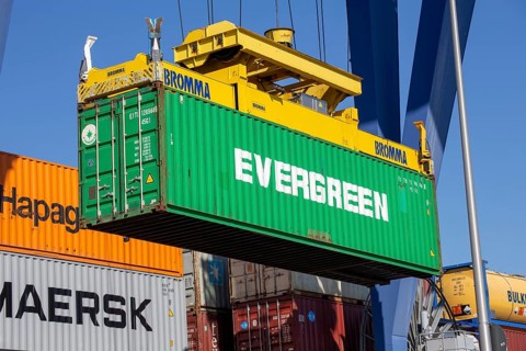 An Evergreen Line container is loaded in the port of Mannheim, Germany. Supply bottlenecks and a