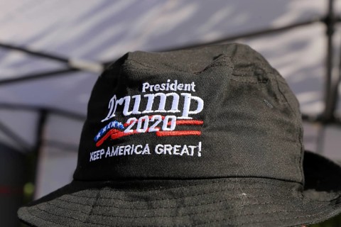 Convinced Trump supporter in Germany wears a cap with the campaign slogan Trump 2020 - keep America