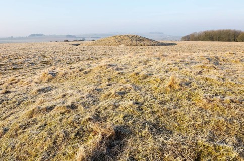 Bronze Age bowl barrow on Windmill Hill, a Neolithic causewayed enclosure, near Avebury, Wiltshire,