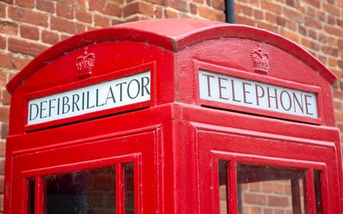 Old red telephone box used now as a defibrillator