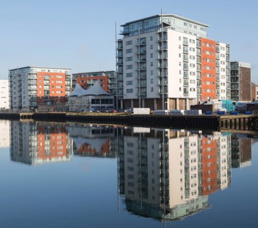 Modern apartments architecture reflected in water Ipswich Wet Dock waterside redevelopment,
